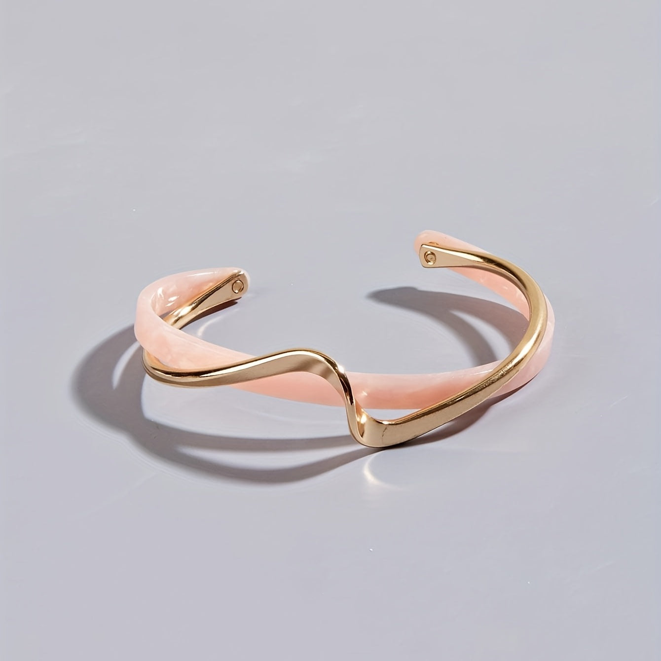 Stijve golfvormige armband verguld met 18K goud