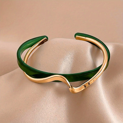 Stijve golfvormige armband verguld met 18K goud