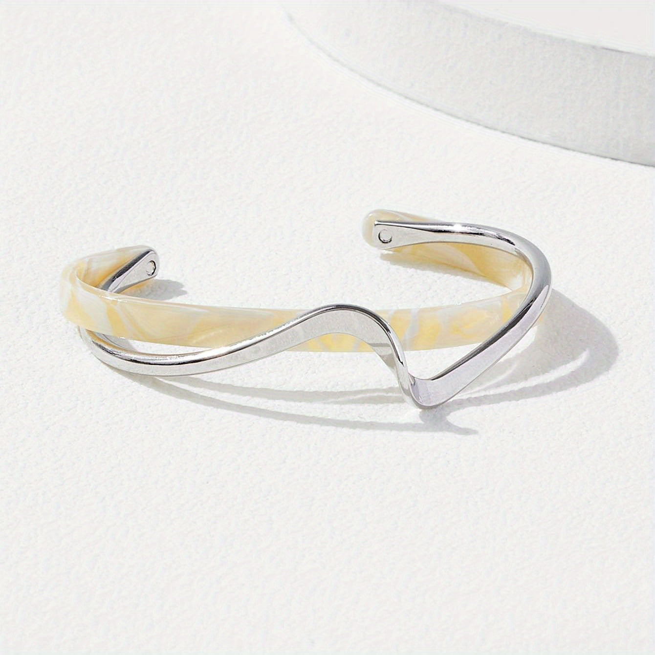 Stijve golfvormige armband verguld met 18K goud