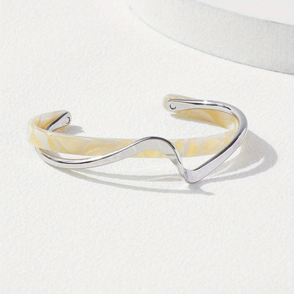 Stijve golfvormige armband verguld met 18K goud