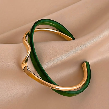 Stijve golfvormige armband verguld met 18K goud