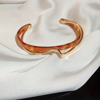 Stijve golfvormige armband verguld met 18K goud