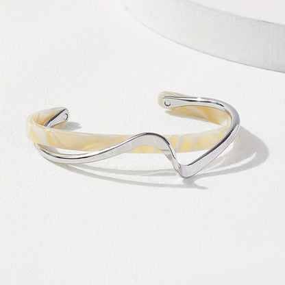 Stijve golfvormige armband verguld met 18K goud