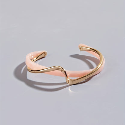 Stijve golfvormige armband verguld met 18K goud