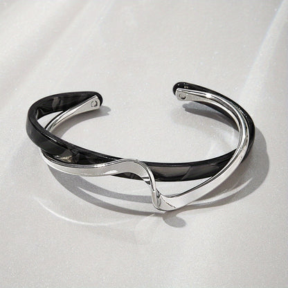 Stijve golfvormige armband verguld met 18K goud