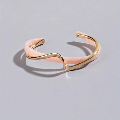 Stijve golfvormige armband verguld met 18K goud
